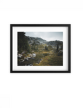 Black-framed Stillwater print with a white mat, showing a quiet alpine pool.