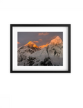 Black-framed Elevation print with a white mat, showing Himalayan peaks at sunrise.