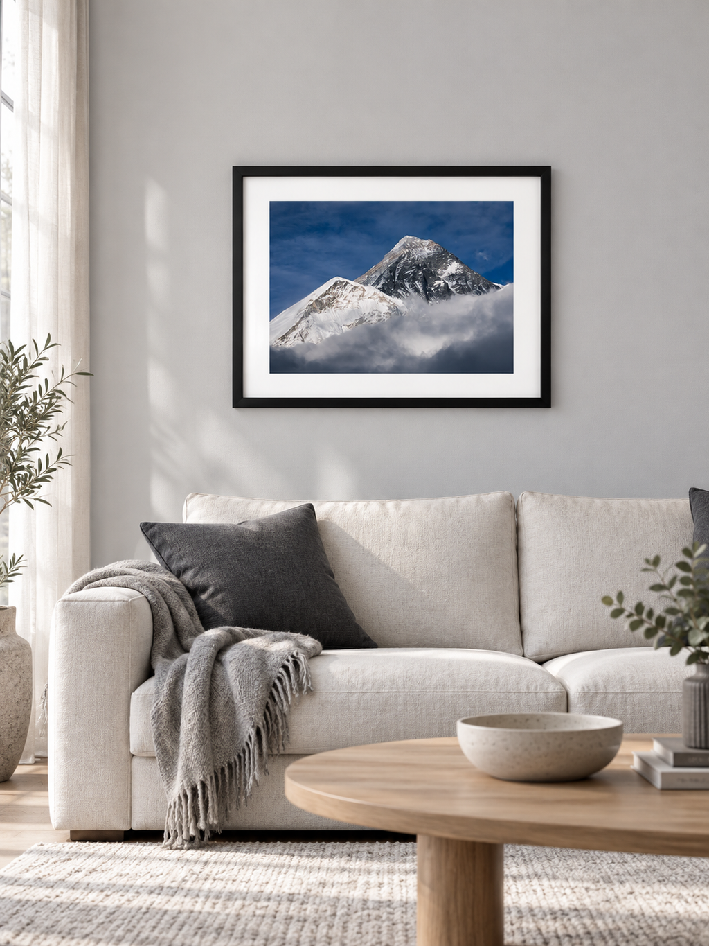 Room mockup of Emergence above a cream sofa.