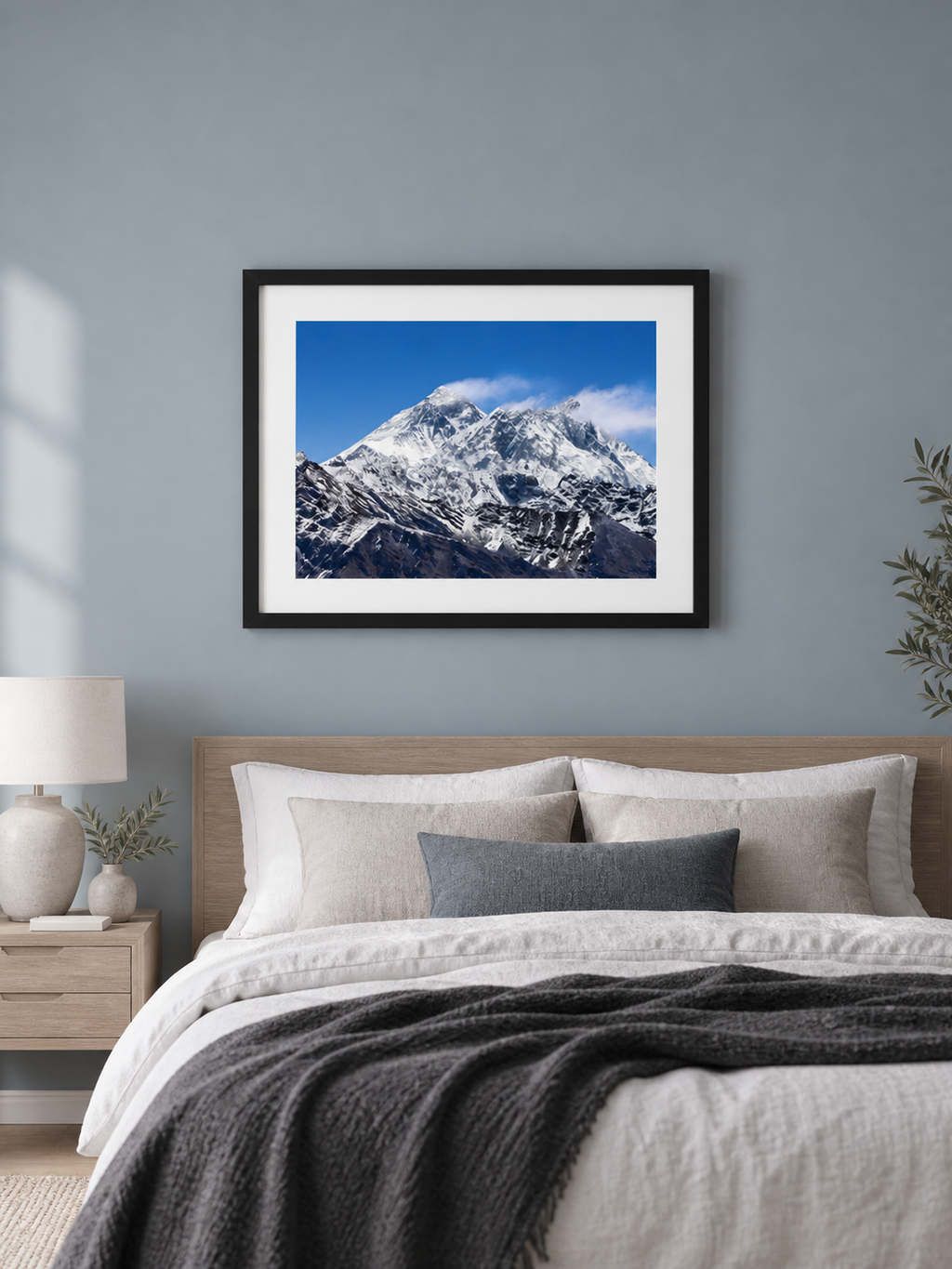 Room mockup of Silence above a bed against a blue-gray wall.
