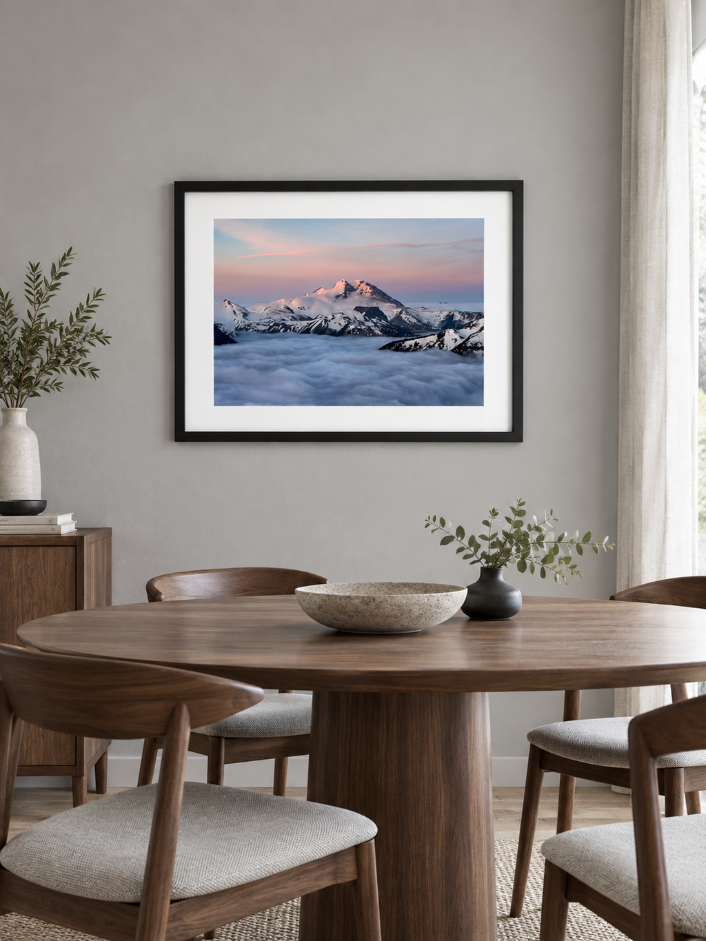 Room mockup of Inversion above a round wooden dining table.