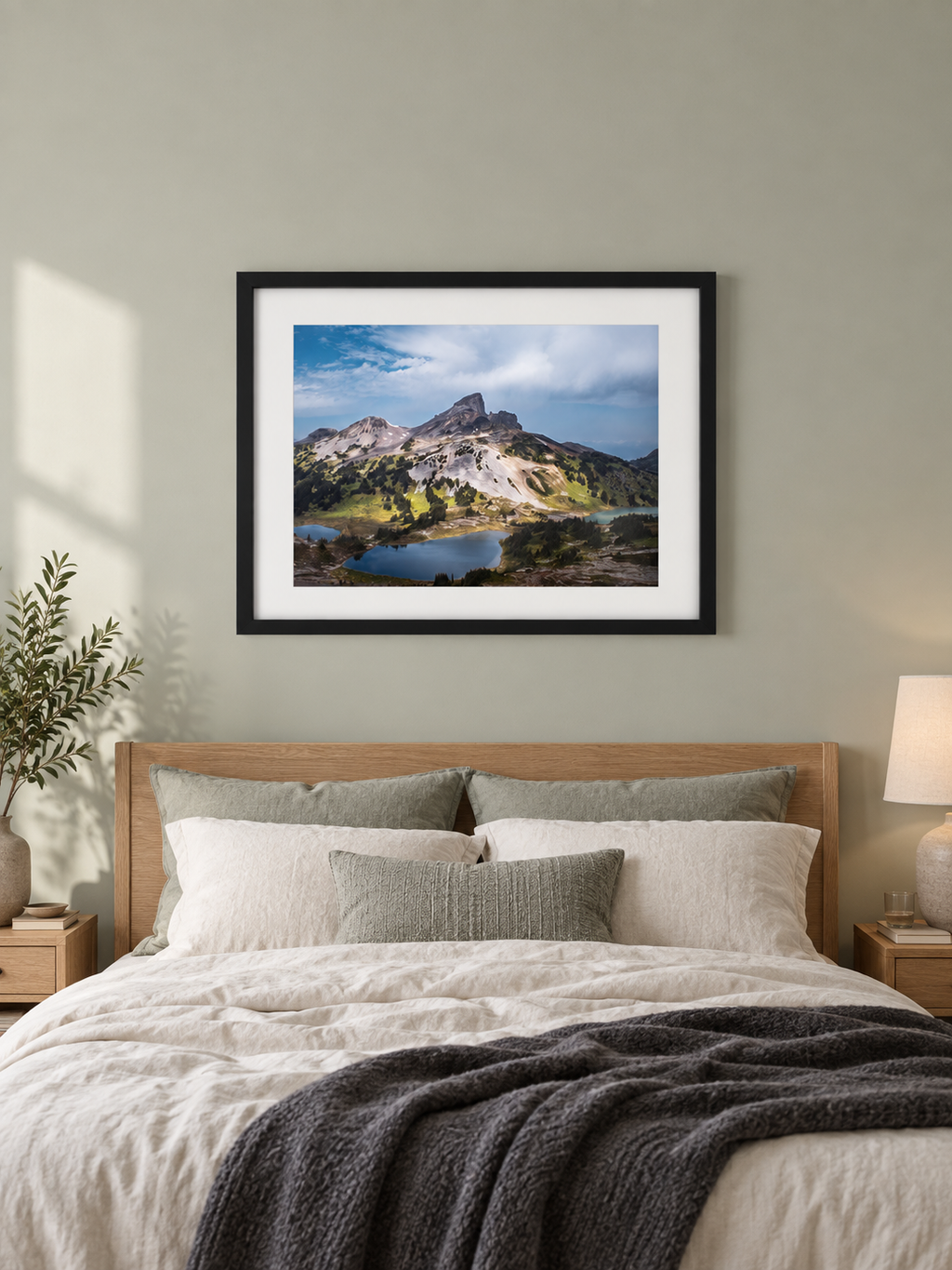 Room mockup of Tusk above a bed against a muted green wall.