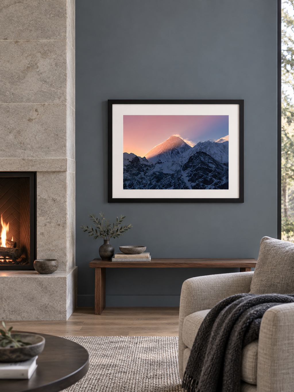 Room mockup of Flame in a black frame beside a stone fireplace.