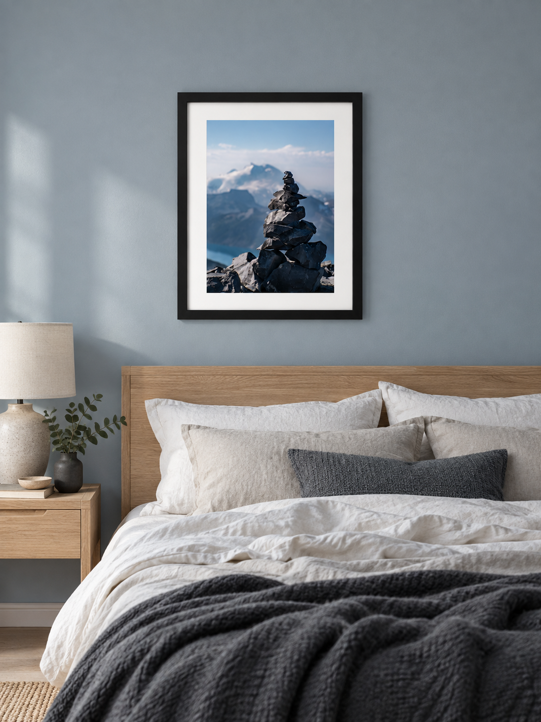 Room mockup of Heights above a bed against a blue-gray wall.