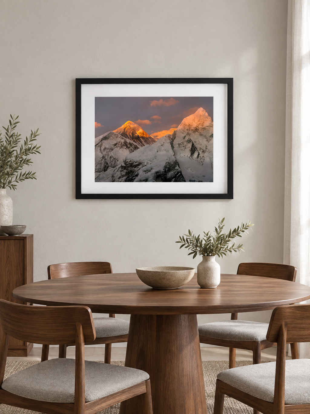 Room mockup of Elevation above a round wooden dining table.