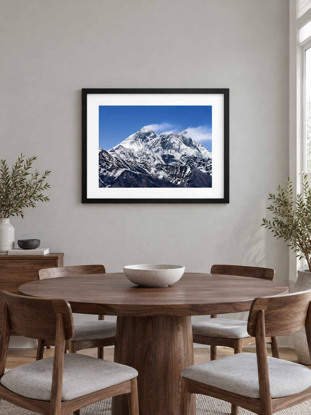 Room mockup of Silence above a round wooden dining table.